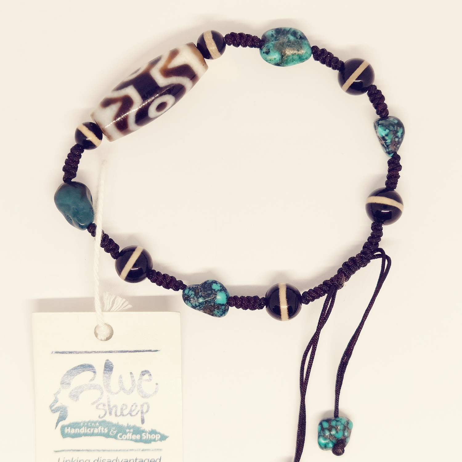 <p>Bema Dzi and Turquoise Bracelets&nbsp;</p>