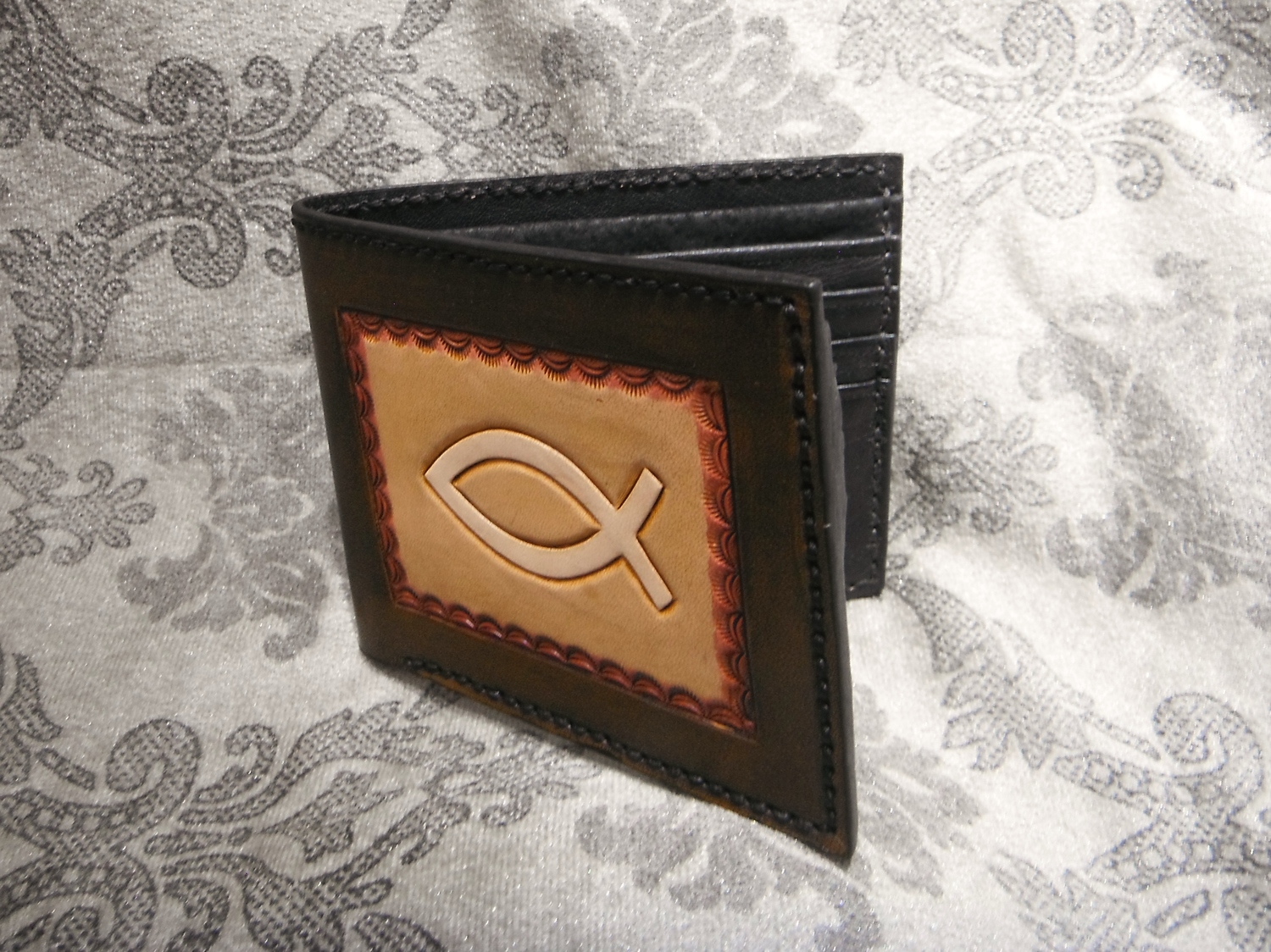 <p>Carved Leather Wallet With Fish Design</p>
